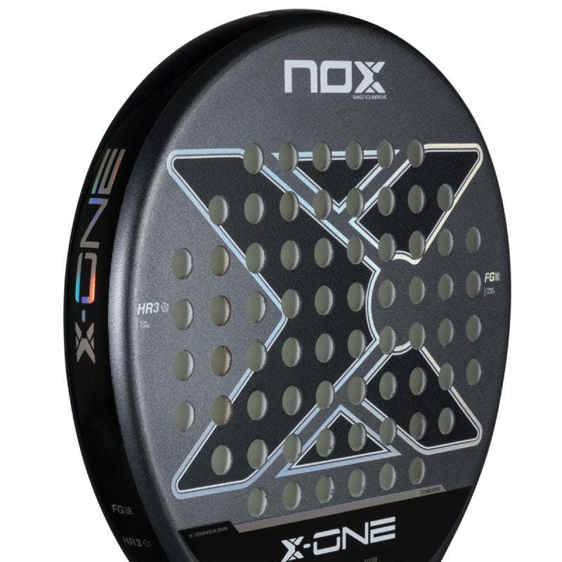 Padel racket Nox X-One 26– a round-shaped padel racket with HR3 Core, 3K Fiberglass, and a carbon frame for excellent control, comfort, and easy handling.