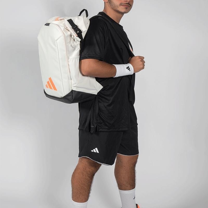 Rucsac adidas Backpack Multigame Off White 2026 pentru padel, alb cu accente portocalii, cu compartiment principal roll-top și compartiment termoizolat pentru rachete